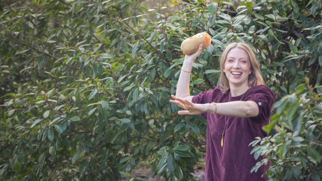 Dr Kathryn Kissell demonstrating contagious stress — the hot potato effect of stress passing between people.